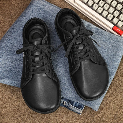 Black marching band shoes with laces, displayed on denim fabric — view 7 — view 4