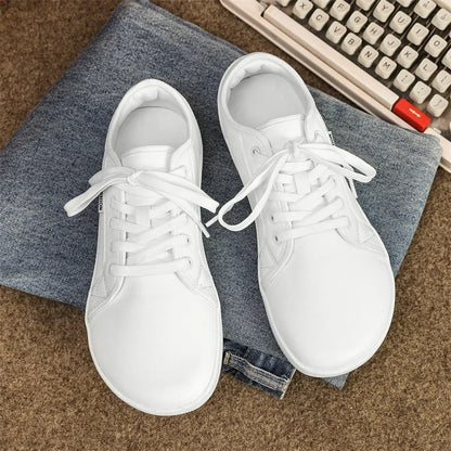 White marching band shoes with laces on a denim surface, top view — 8 — view 5