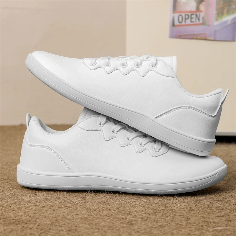 White marching band shoes with laces, featuring a wide fit design, side view — view 2