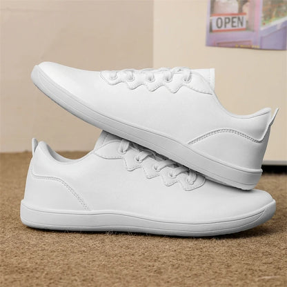 White marching band shoes with laces, featuring a wide fit design, side view — view 2