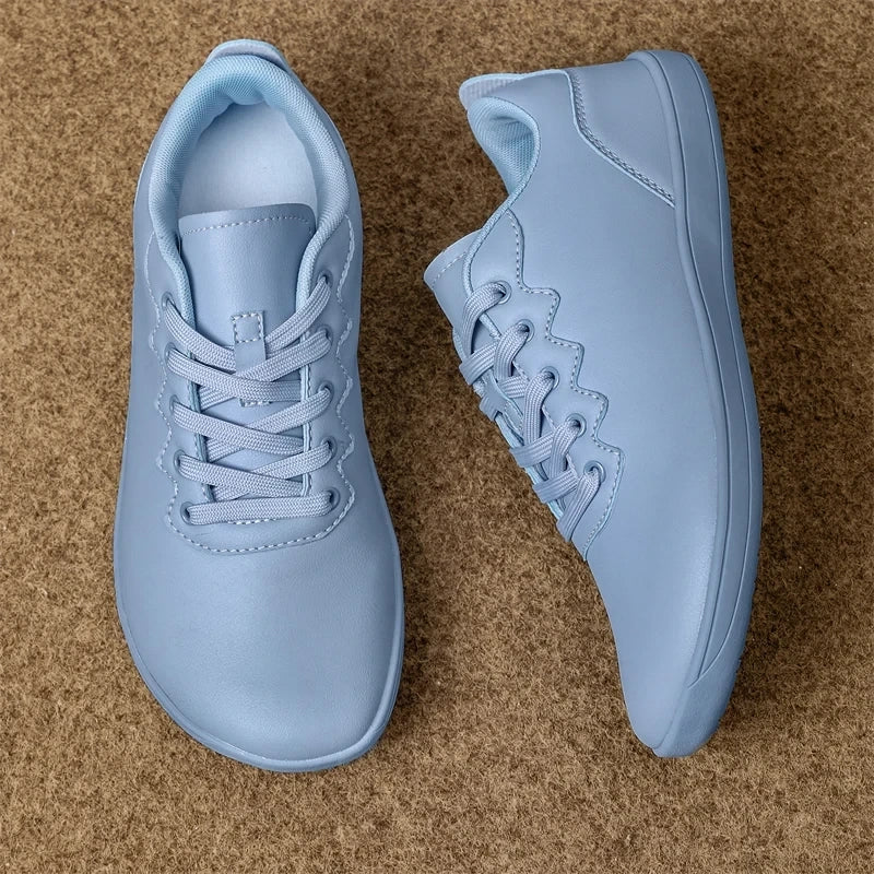 Light blue marching band shoes with laces, wide fit design on a carpeted surface — view 6 — view 5