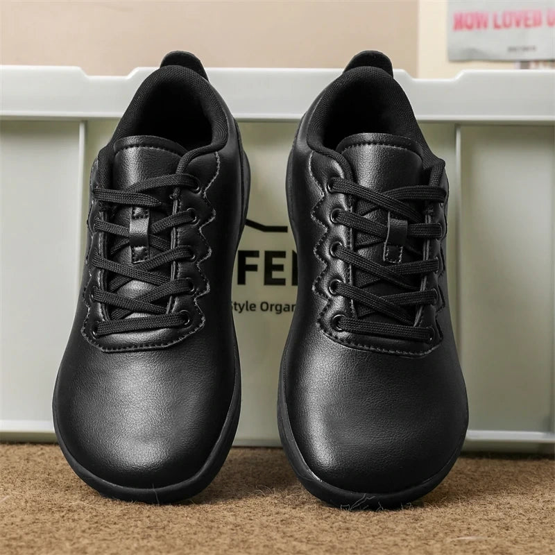Black breathable wide toe marching band shoes with lace up design, front view — view 2
