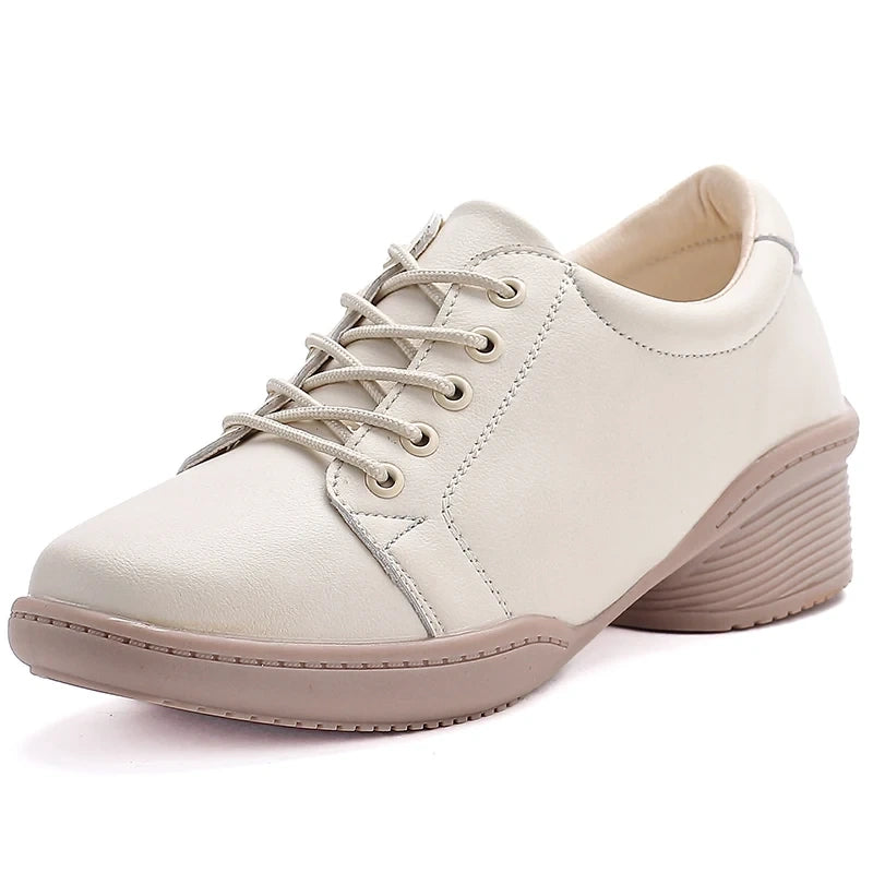 Cream colored marching band shoes with lace up design and cushioned sole — view 8 — view 6