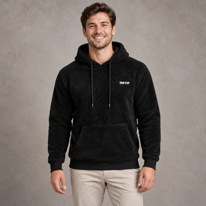 mens hoodie — Black Paul plush fleece pullover hoodie, complete front view on young model in warm neutral