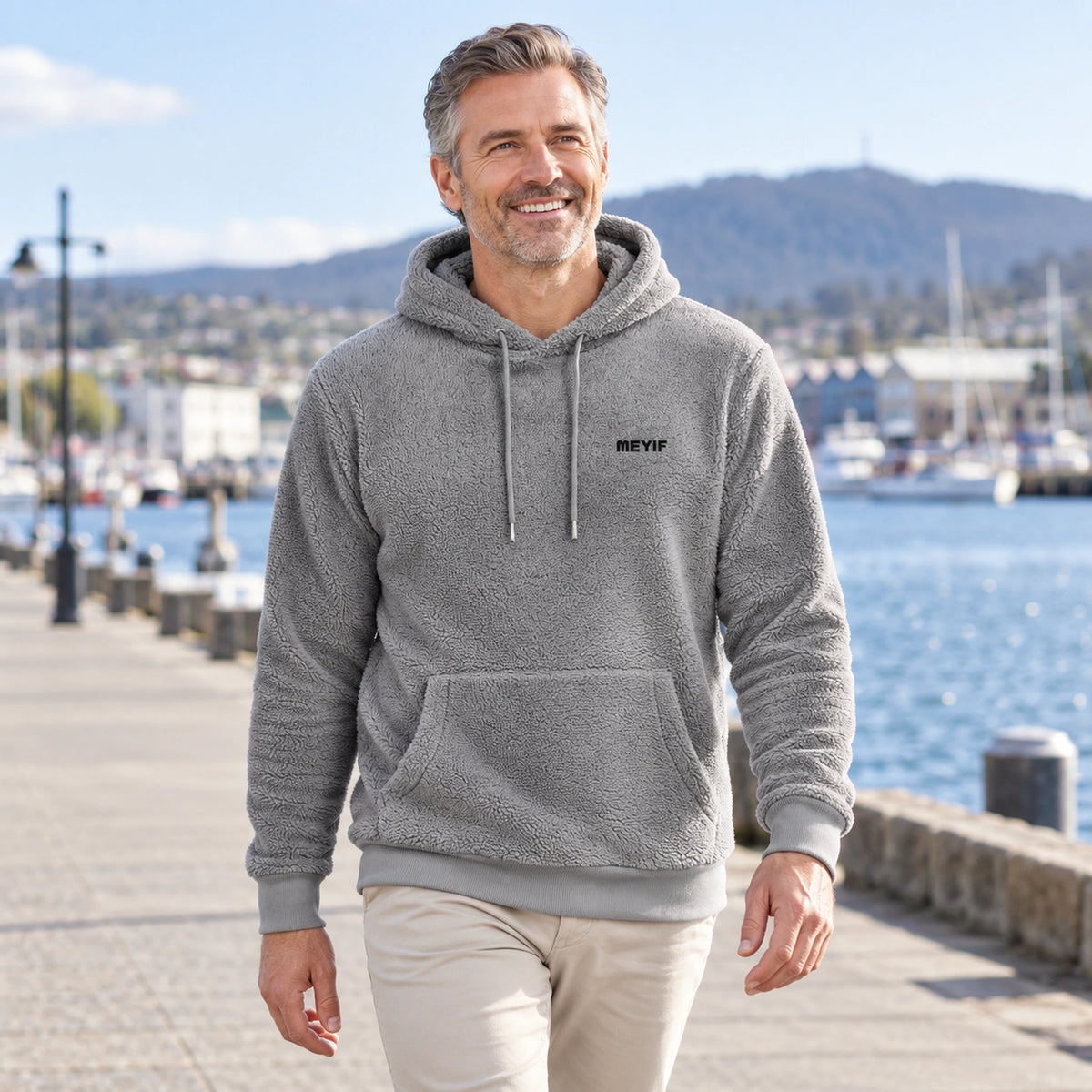 mens hoodie — Gray Paul plush fleece pullover hoodie, mature model walking beside Tasmanian harbour — view 8