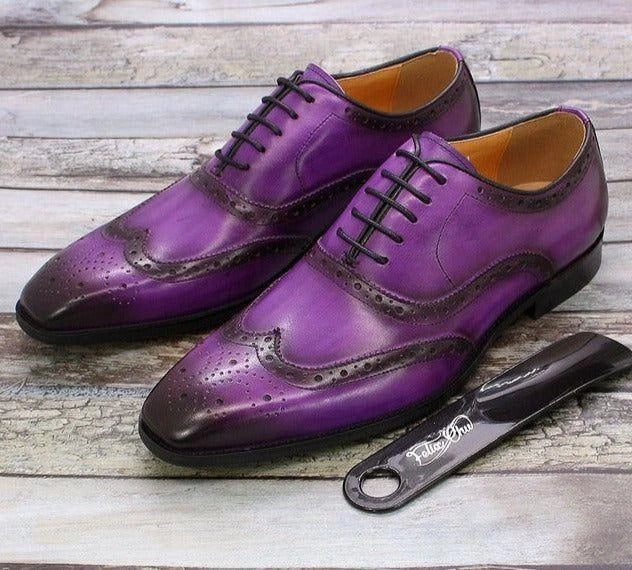 Purple oxford loafers with decorative perforations and black laces, displayed on a wooden surface — view 4 — view 5