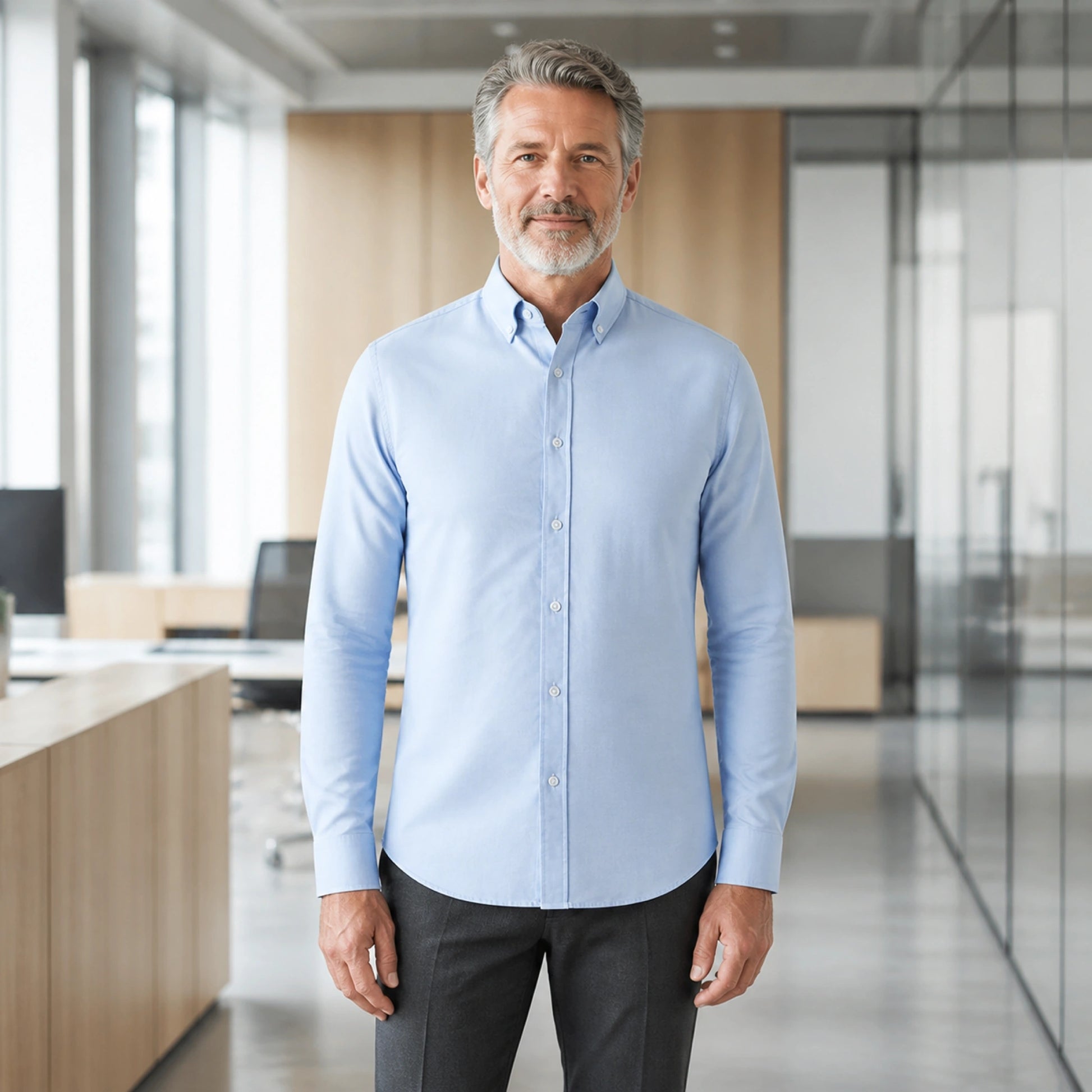 Mature man wearing Blue smart casual long sleeve Oxford shirt, full front view with button down collar, cuffs, and — view 2
