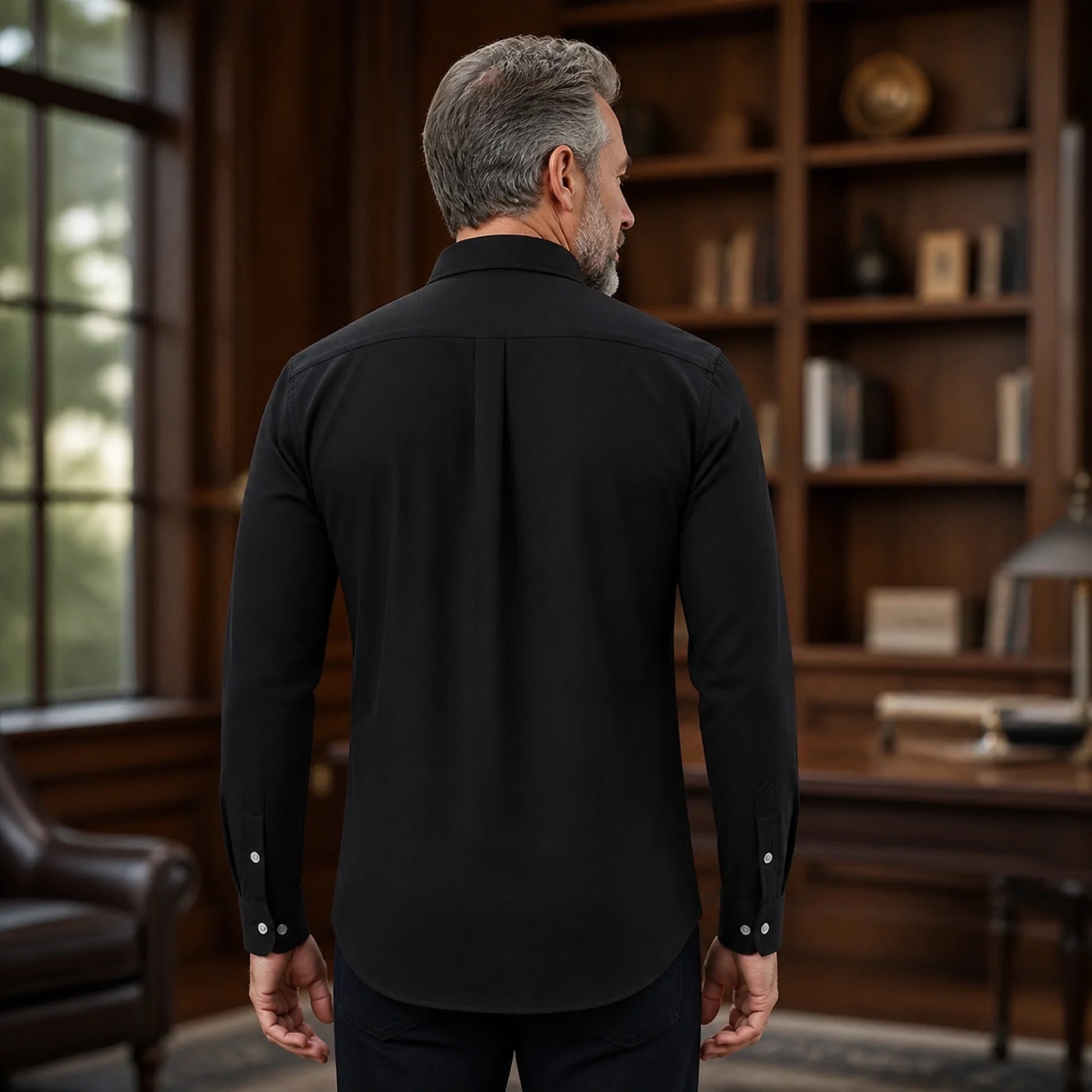 Mature man wearing Black smart casual long sleeve Oxford shirt, realistic rear view showing collar, yoke, sleeves — view 7