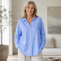 oxford shirt — Professional mature woman wearing the exact oversized Oxford blouse