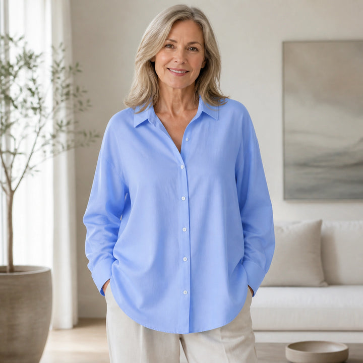 oxford shirt — Professional mature woman wearing the exact oversized Oxford blouse