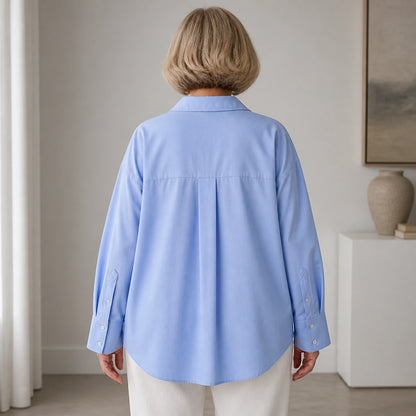 oxford shirt — Professional mature woman wearing the exact oversized Oxford blouse — view 5