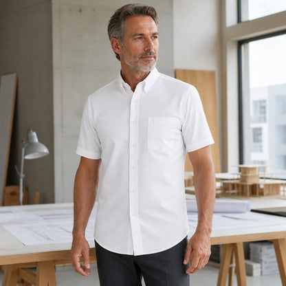 Mature man wearing the white short sleeved Oxford shirt, complete collar to hem front view in a bright