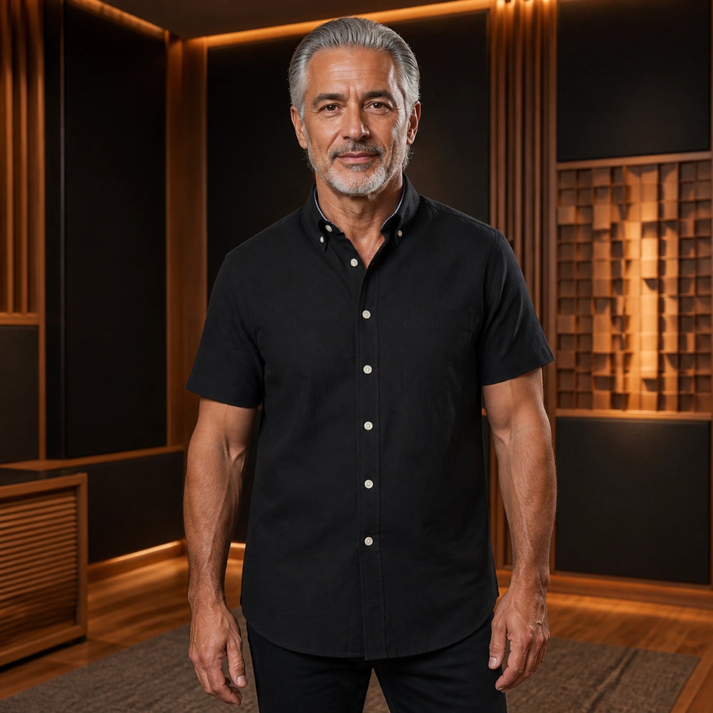 Mature man wearing the black short sleeved Oxford shirt, complete collar to hem front view in a warm — view 4