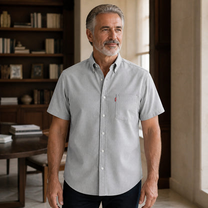 Mature man wearing Gray classic fit short sleeve Oxford shirt, full front view with button down collar, chest — view 5