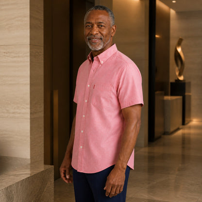 Mature man wearing Pink classic fit short sleeve Oxford shirt, realistic side view showing collar, pocket, seam, and — view 8