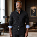 Professional mature man wearing the exact comfortable Oxford shirt