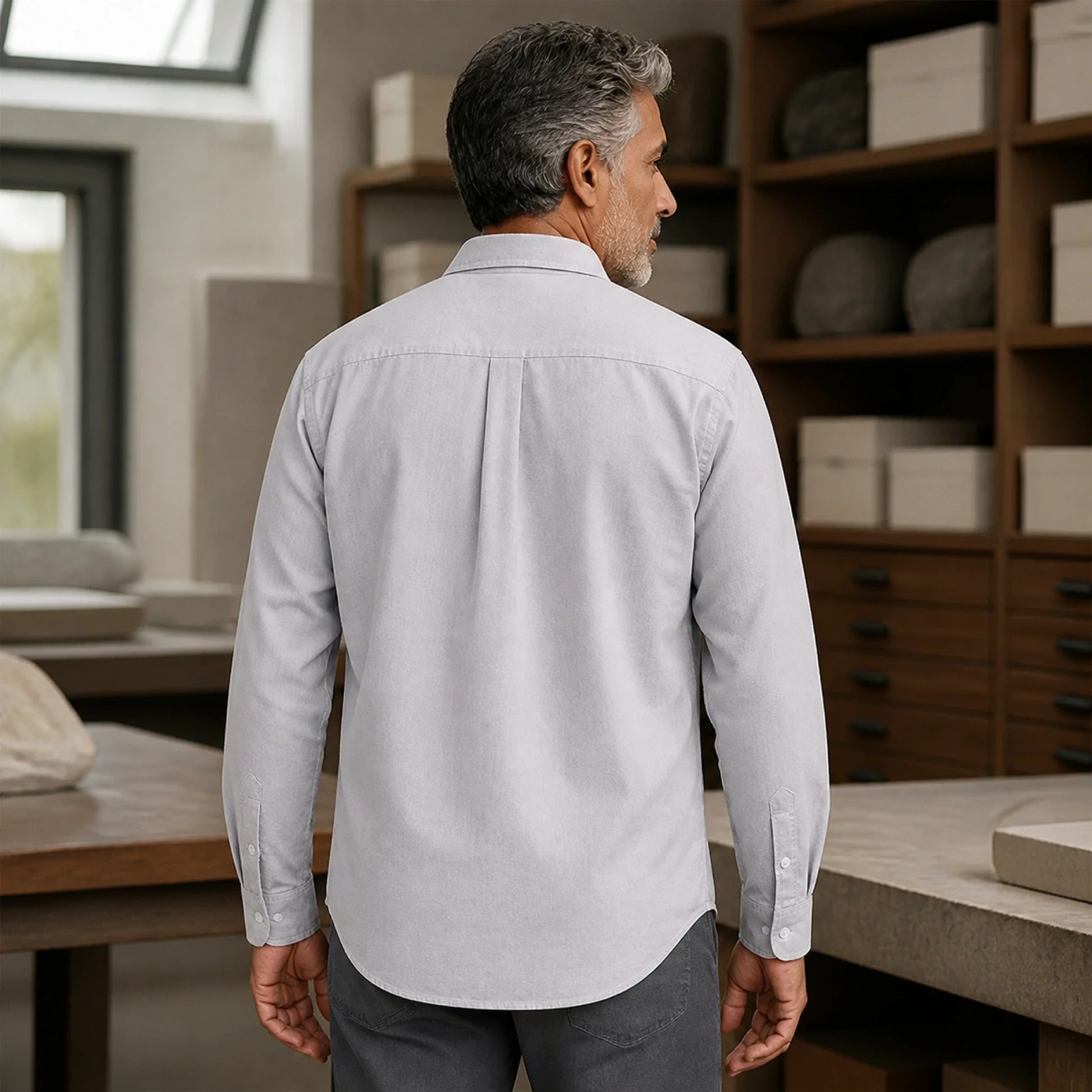 Mature man wearing Gray slim fit long sleeve Oxford shirt, realistic rear view showing collar, yoke, center pleat — view 10