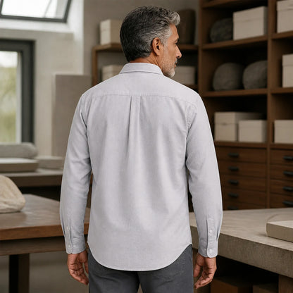 Mature man wearing Gray slim fit long sleeve Oxford shirt, realistic rear view showing collar, yoke, center pleat — view 10