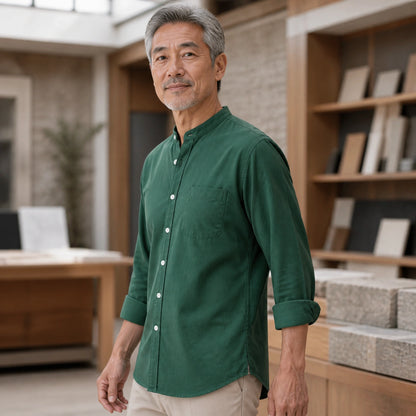Mature man wearing the green slim fit cotton Oxford shirt, realistic side view showing sleeve, cuff, and curved hem — view 7