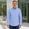 Professional mature man wearing the exact slim fit Oxford shirt