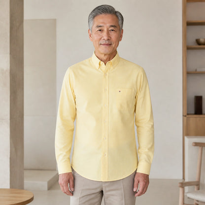 Mature man wearing Yellow long sleeve casual Oxford shirt, full front view with button down collar, chest pocket — view 8