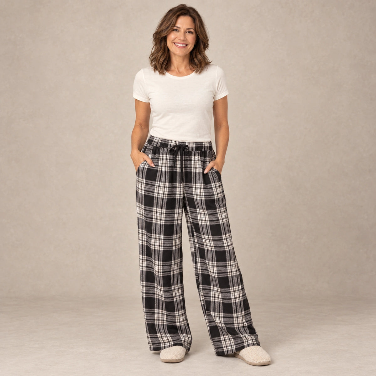 Black And White Plaid wide leg pajama pants, complete front view on mature model in a warm neutral
