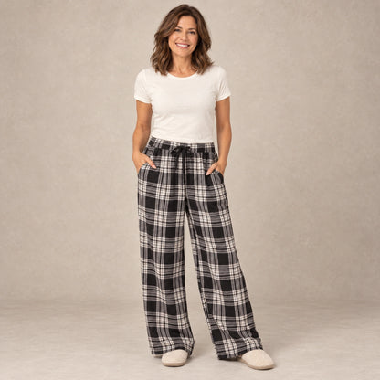 Black And White Plaid wide leg pajama pants, complete front view on mature model in a warm neutral