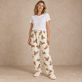 Cream Bear Print plush pajama pants, complete front view in a warm neutral