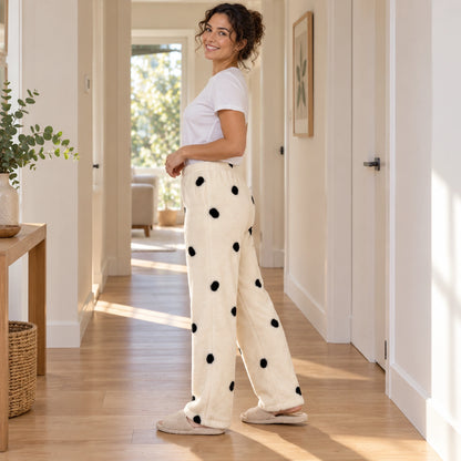 Cream Black Spot Print plush pajama pants, full side view on a model at home — view 4