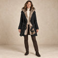 parka coat — Image; complete full front view; Black belinda garment worn by a happy adult model
