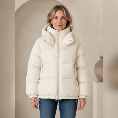 Woman wearing ivory hooded puffer parka coat, complete front view — view 2