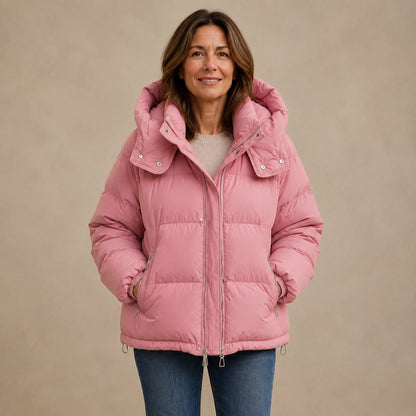Woman wearing dusty pink hooded puffer parka coat, complete front view — view 4