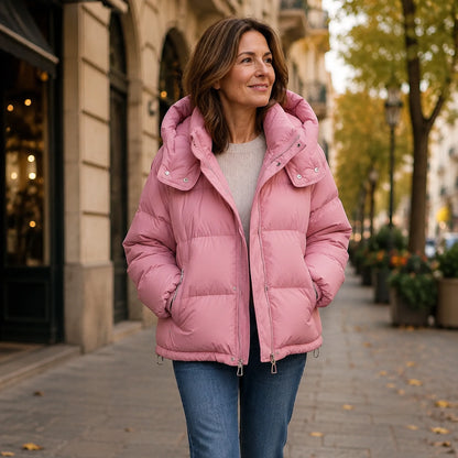 Woman wearing dusty pink hooded puffer parka coat on an autumn city walk — view 8