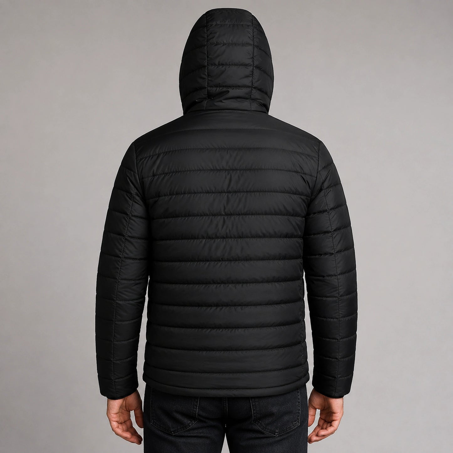 Man wearing black USB heated hooded parka coat, complete rear view — view 3
