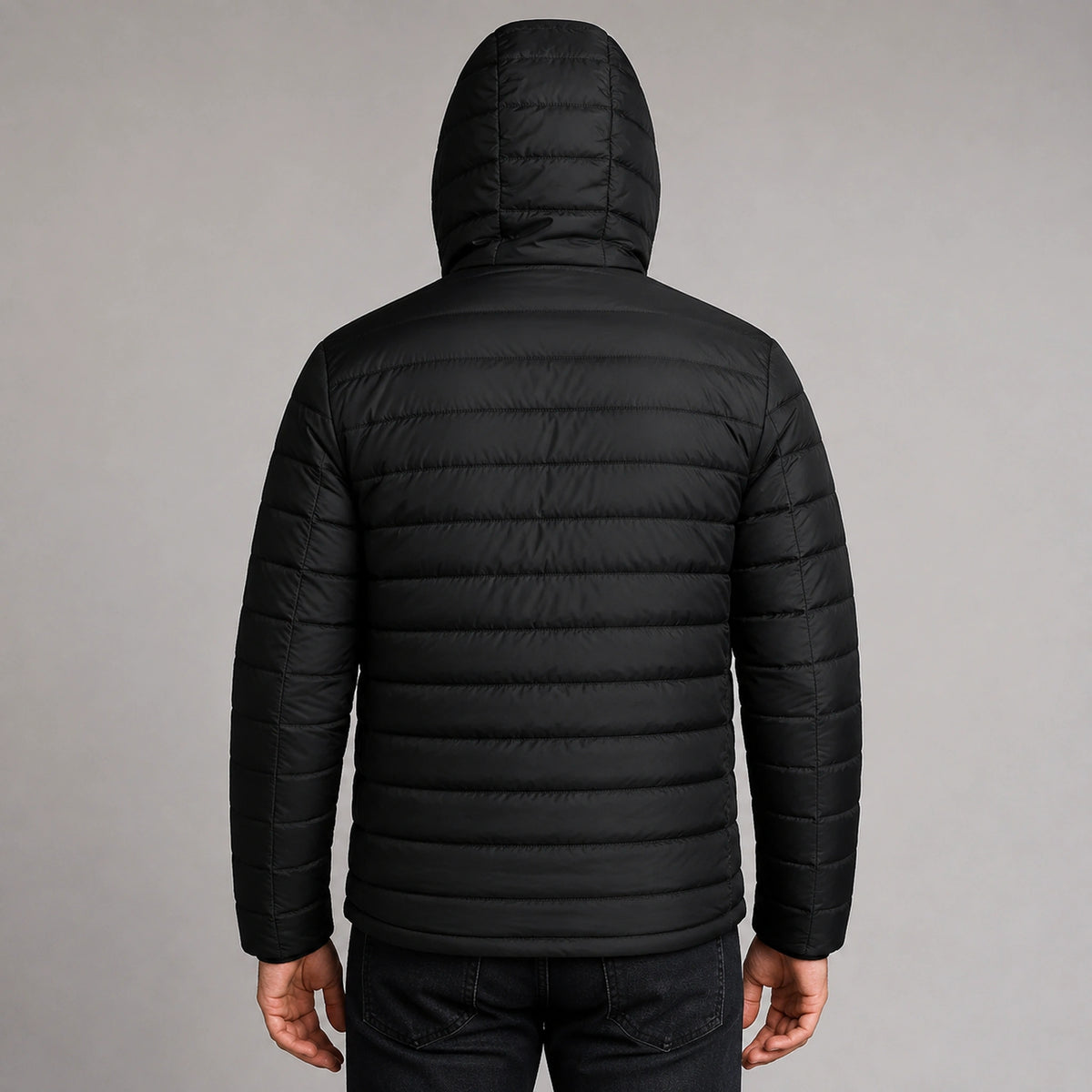 Man wearing black USB heated hooded parka coat, complete rear view — view 3
