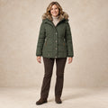 parka coat — Image; complete full front view; Green sheryl garment worn by a happy adult model