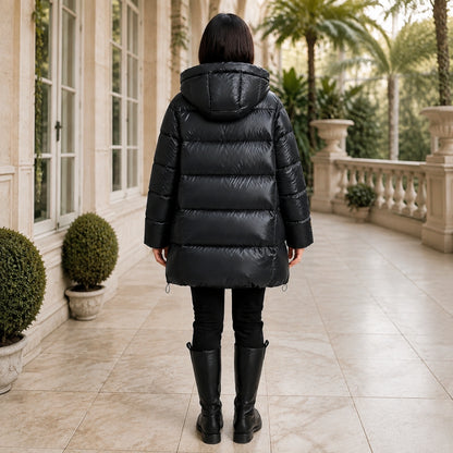 parka coat — Woman wearing glossy black hooded puffer coat, complete rear view — view 3