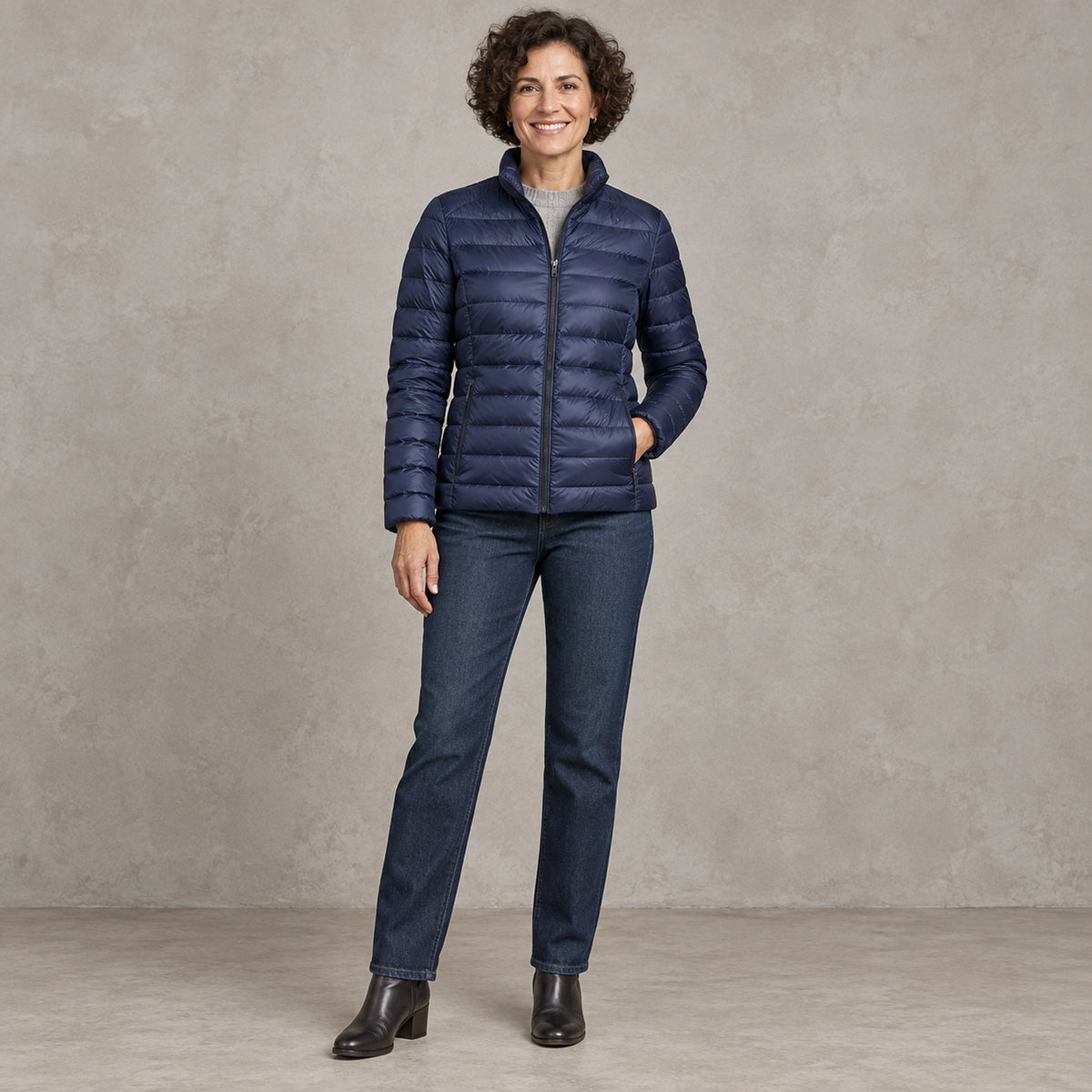 puffer jacket — Full front view; Navy Blue; complete product worn by a happy adult model — view 2