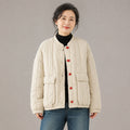 Beige cotton linen short quilted jacket front view on a model