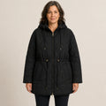 Black hooded longline quilted jacket front view on a model