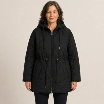 Black hooded longline quilted jacket front view on a model
