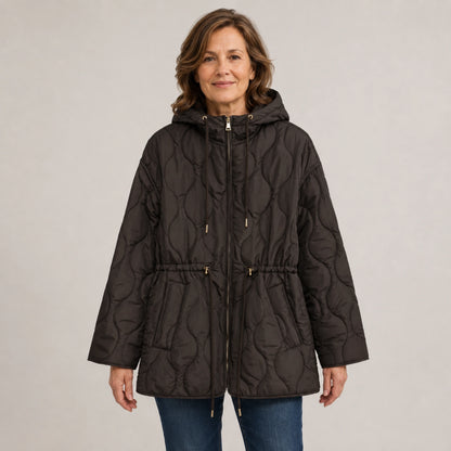 Brown hooded longline quilted jacket front view on a model — view 3