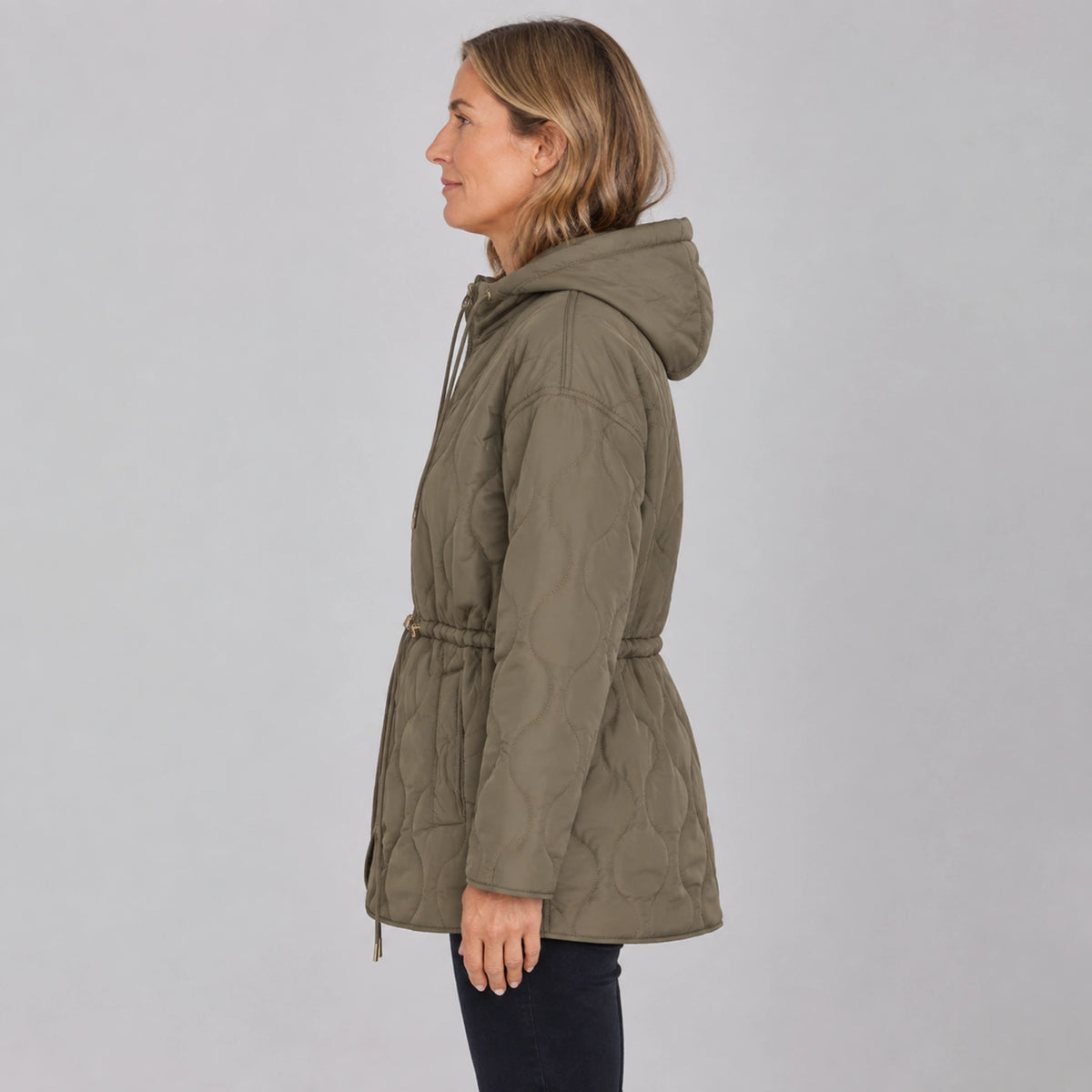 Army Green hooded longline quilted jacket true side view on a model — view 5