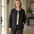 Claire black collarless quilted jacket complete front view