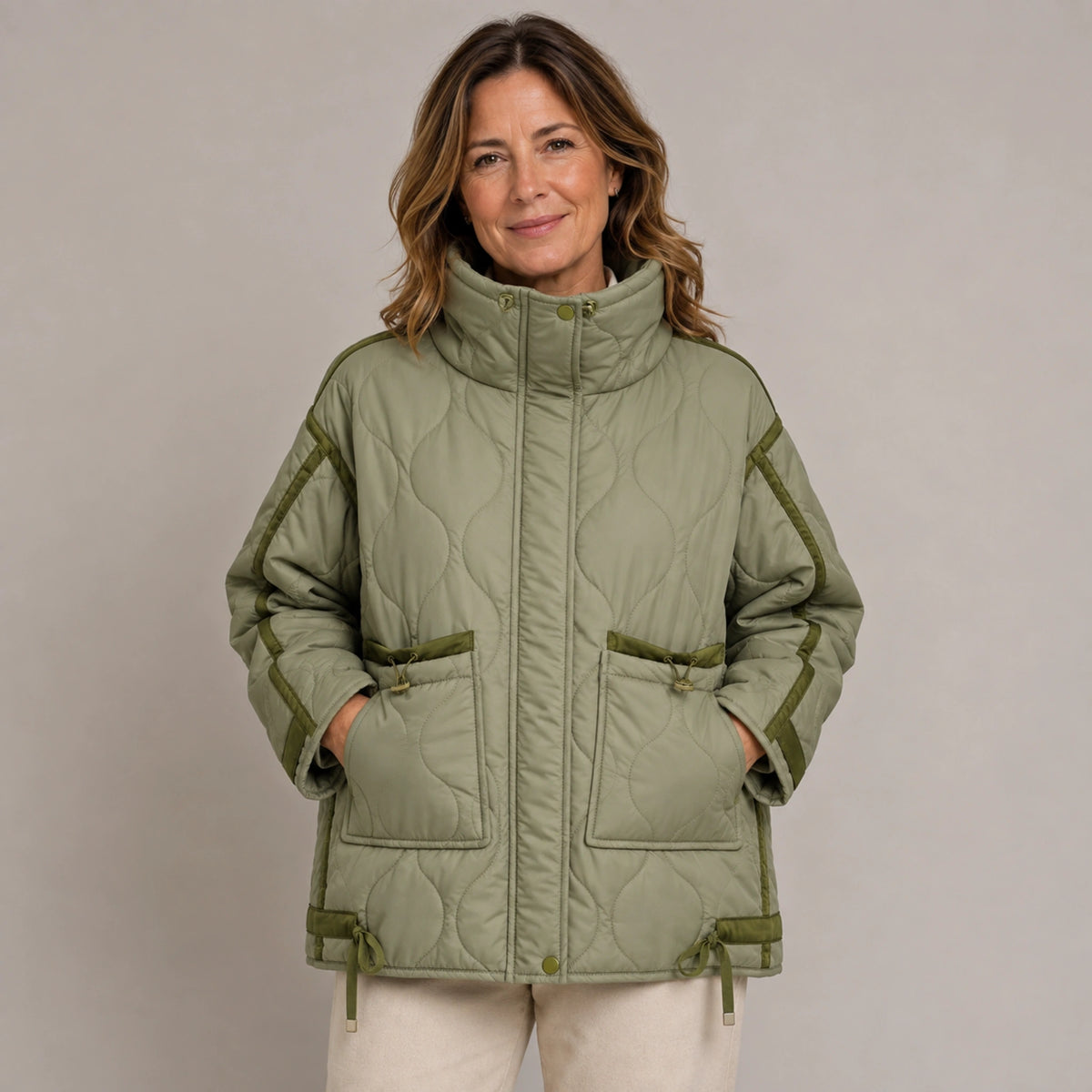 quilted jacket — Army Green quilted coat pocket construction detail on a model — view 9