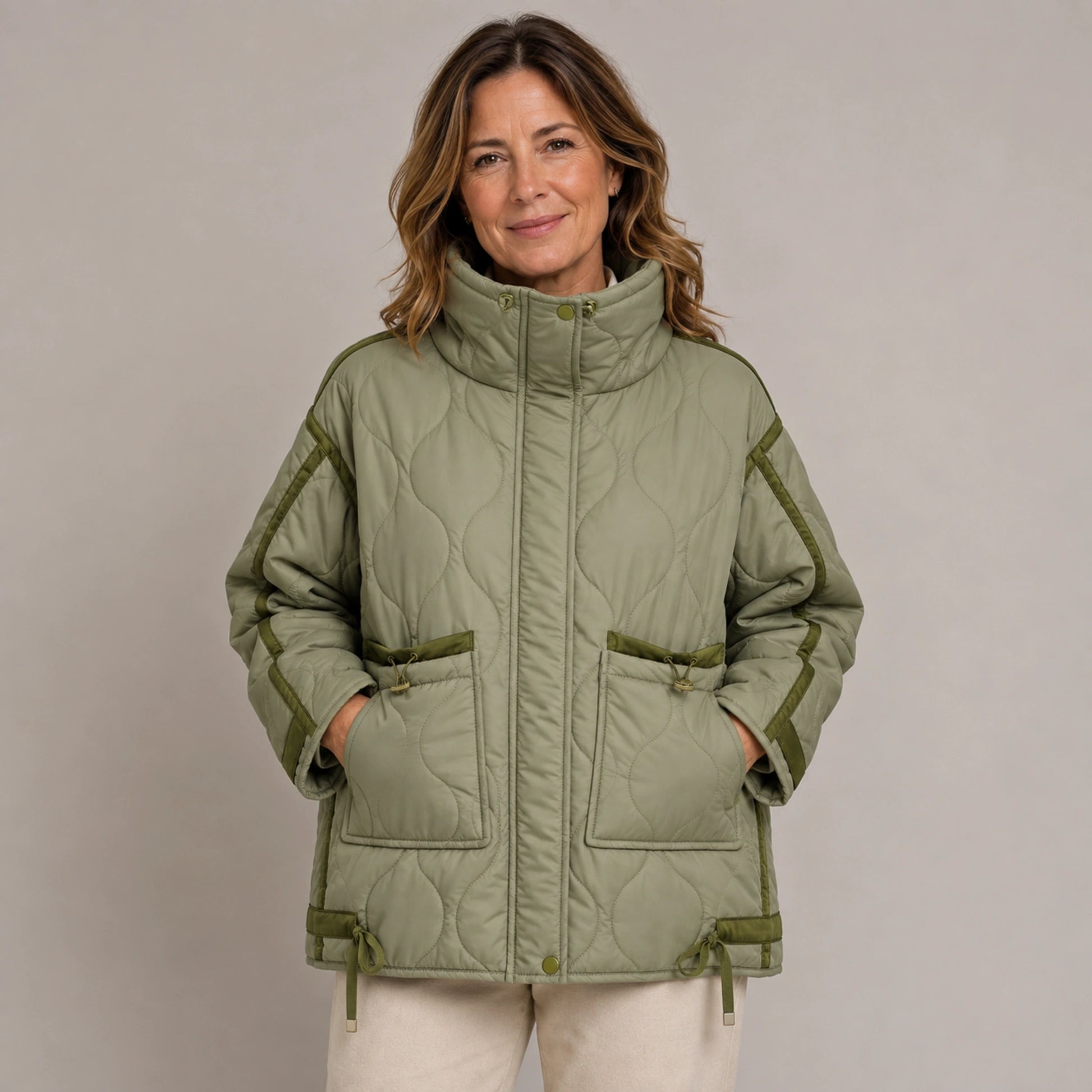 quilted jacket — Army Green quilted coat pocket construction detail on a model — view 9
