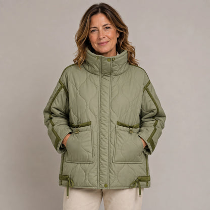 quilted jacket — Army Green quilted coat pocket construction detail on a model — view 9