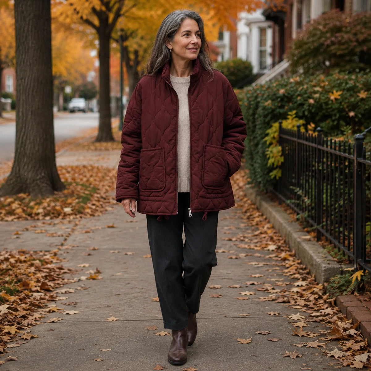 Woman wearing the Sophia burgundy quilted jacket on an autumn walk — view 9