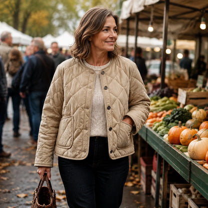 Woman wearing the Violet khaki quilted jacket at an autumn market — view 6