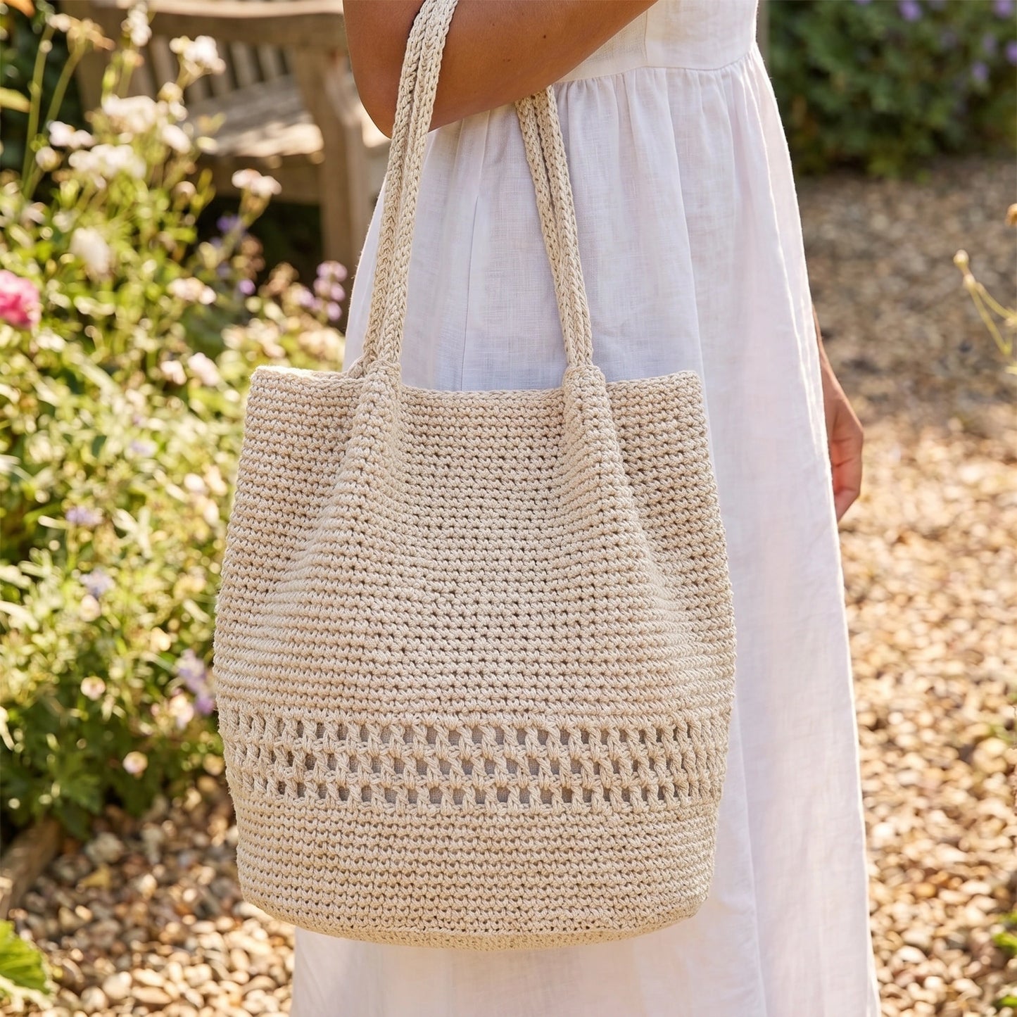 Close up view of the charming hand crocheted summer tote showing intricate stitching and lightweight fabric in a — view 6